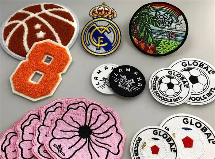 Embroidered and chenille patches with laser-cut edges